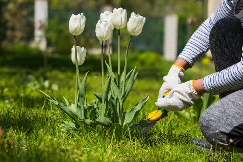 Professional gardeners maintaining a landscaped garden in Aldwych